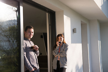 Image showing couple enjoying on the door of their luxury home villa