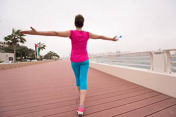 Image showing young woman celebrating a successful training run