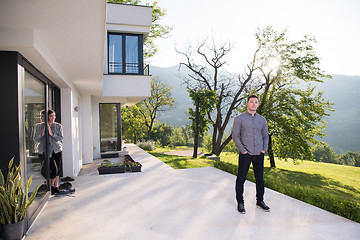 Image showing man in front of his luxury home villa