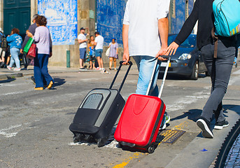 Image showing Tourists carrying bags on street