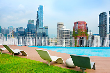 Image showing Rooftop deck chairs. Singapore Downtown