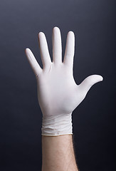 Image showing Male hand in latex glove