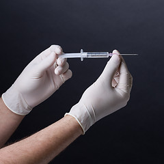 Image showing Hands with syringe