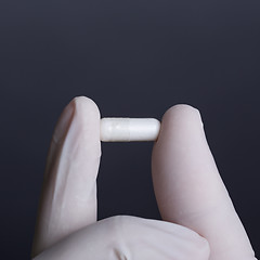 Image showing Hand with capsule