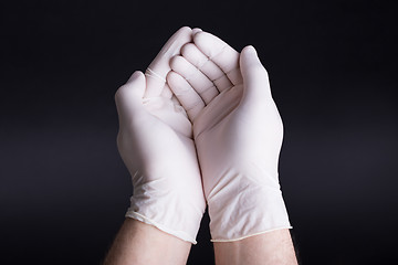 Image showing Male hands in latex gloves