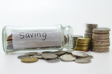 Image showing Clear glass jar for tips with money