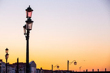 Image showing Street lamp silhouette in Venice, Italy at sunrise