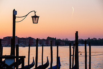 Image showing Street lamp and gondolas in Venice, Italy