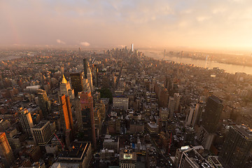 Image showing New York City skyline with urban skyscrapers at sunset, USA.