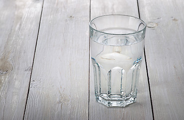 Image showing Glass of water on white wooden table