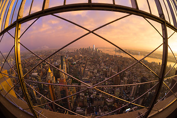 Image showing New York City skyline with Manhattan skyscrapers at dramatic stormy sunset, USA.