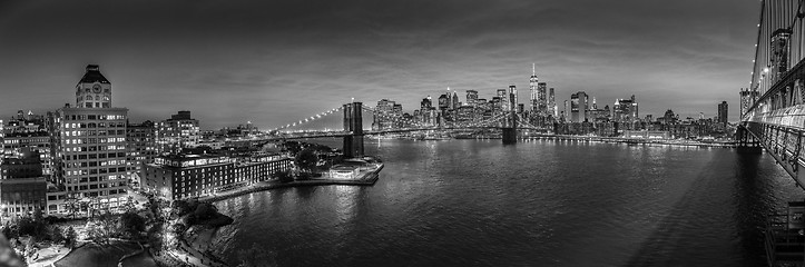 Image showing Brooklyn Bridge and Lower Manhattan skyline at night, New York city, USA.