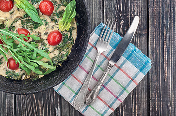 Image showing Fritatta with tomatoes on an iron frying pan