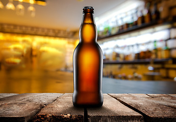 Image showing Beer in dark pub