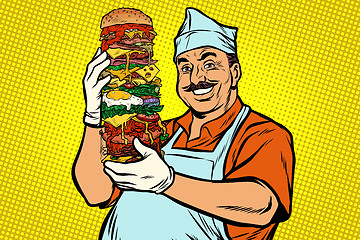 Image showing smiling Oriental street food chef. big Burger