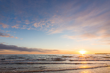 Image showing Cloudy sky above the sea at sunset
