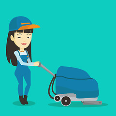 Image showing Female worker cleaning store floor with machine.