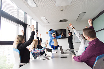 Image showing boss dresed as bear having fun with business people in trendy of