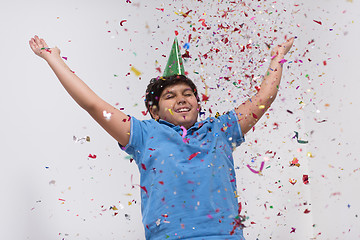 Image showing kid blowing confetti