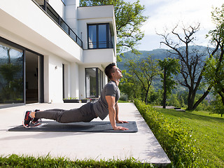 Image showing man doing morning yoga exercises