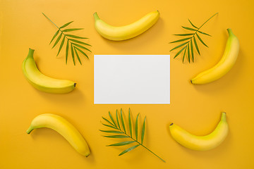 Image showing Bananas, palm leaves and blank paper sheet