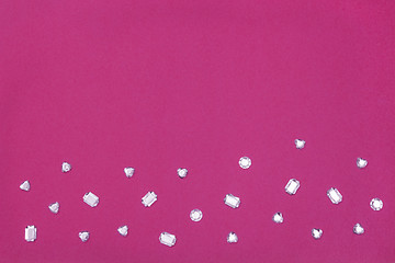 Image showing Rhinestones on vibrant magenta background