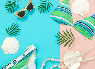 Image showing Summer fashion flat lay on blue and pink background