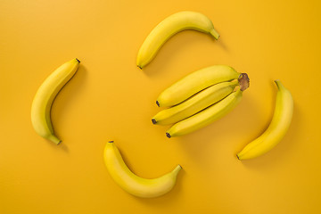 Image showing Bananas on bright yellow background