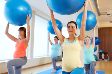 Image showing pregnant women training with exercise balls in gym