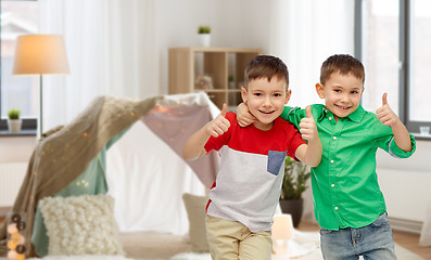 Image showing happy smiling little boys showing thumbs up