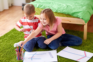 Image showing happy creative kids drawing at home