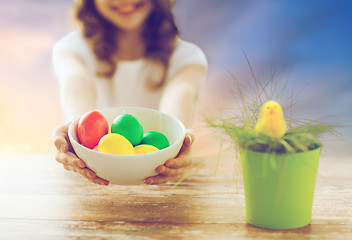 Image showing close up of girl holding colored easter eggs