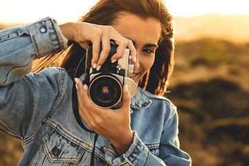 Image showing Woman Taking Picture Outdoors