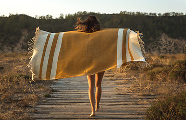 Image showing Beautiful woman wrapped in a wool towel