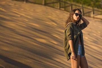 Image showing Woman at a sand dune