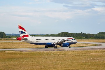 Image showing Plane rolling on a taxiway