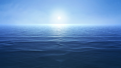 Image showing a blue ocean with sun over the horizon