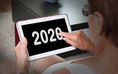 Image showing Senior lady relaxing and her tablet - 2020