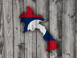 Image showing Map and flag of Laos on weathered wood