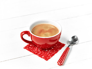 Image showing red coffee cup on wood table