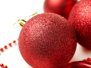 Image showing three red christmas balls isolated on white background