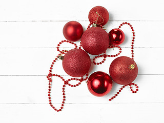 Image showing three red christmas balls isolated on white background