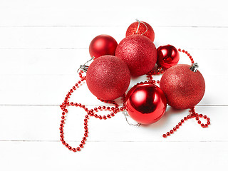 Image showing three red christmas balls isolated on white background