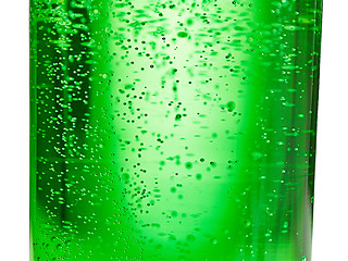 Image showing abstract background : bubble of sparkling water soda on the green glass bottle with gradient light