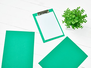 Image showing Office table desk with set of colorful supplies, white blank not