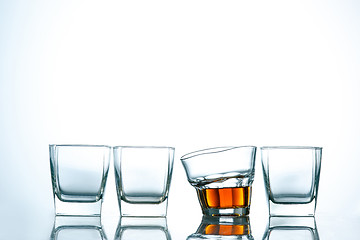 Image showing The curved glass of whiskey or alcohol drink