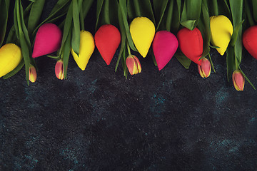 Image showing Handmade and real tulips on darken