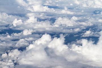 Image showing Sunrise above clouds from airplane window