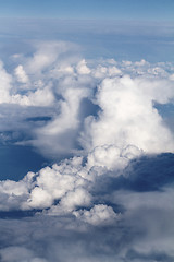 Image showing Sunrise above clouds from airplane window