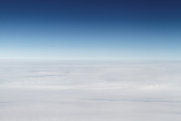 Image showing Sunrise above clouds from airplane window